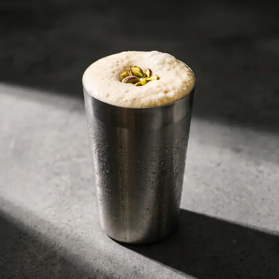 Sweet lassi in a steel tumbler